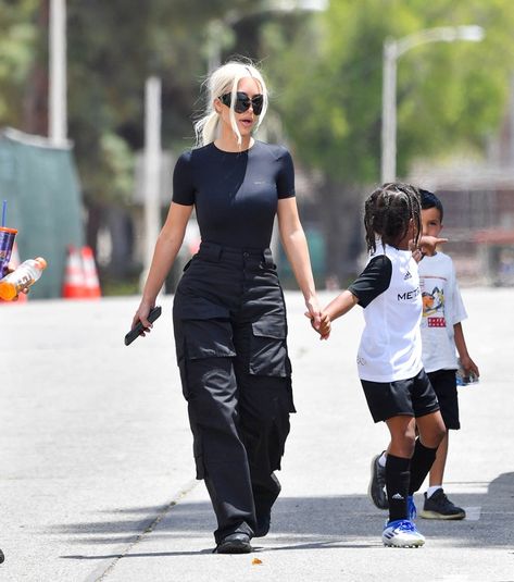 Kim Kardashian Gets Slick In Bodysuit for Saint West Soccer Game – Footwear News Body Suit Outfits Jeans Casual, Bodysuit Cargo Pants, Parachute Pants Outfit, Estilo Kim Kardashian, Sporty Chic Outfits, Saturday Outfit, Versatile Sneakers, Saint West, Kim Kardashian Outfits