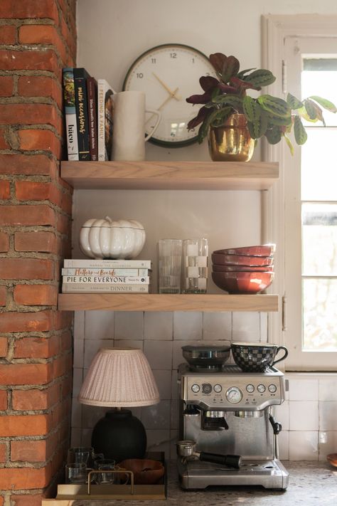 It was time for a little refresh of the shelves with some fall decor. Add in a pumpkin baking dish, the more gorgeous new burgandy bowls, and some checkered pattern which is very popular this fall. The color of the plant is also perfect going into fall. Cookbooks In Kitchen Displaying, Kitchen Open Shelf Styling, Bar With Floating Shelves, Kitchen Shelf Ideas, Small Kitchen Shelf, Bookshelves Display, Fall Shelf Decor, Pumpkin Baking, Kitchen Shelf Styling