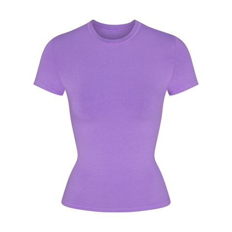 Our viral t-shirt in the cotton everyone craves. This perfect five-star tee is made with our stretchy, lightweight cotton that enhances your curves with its body-hugging fit and elevates your comfort with its incredibly soft feel. Features stitching details along the short sleeves and hem and hits below the natural waist. Fits true to size. Pink And Purple Clothes, Basic Top Outfit, Purple Shirt Outfits, Purple Top Outfit, Purple Shirts, Purple Clothes, Purple Tops, Preppy Clothes, Purple Tee