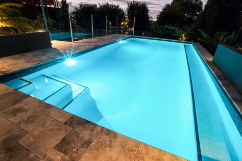 Outdoor area with swimming pool, steps, stone deck, and pool plaster Salt Finish Concrete, Pool Plaster Colors, Pool Deck Design, Pool Stairs, Concrete Pool Deck, Stairs Colours, Kidney Shaped Pool, Pool Plaster, Stone Deck