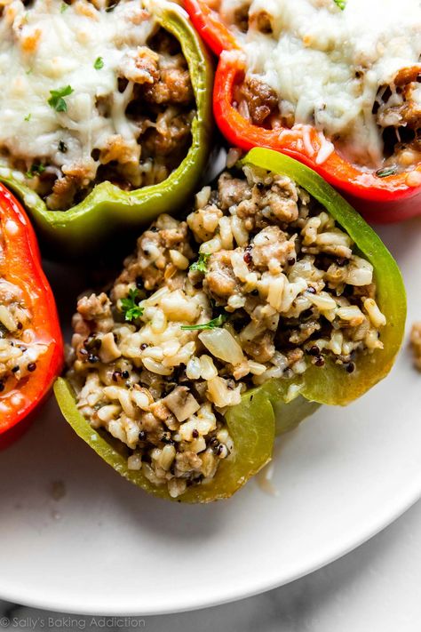 Learn how to make sausage stuffed peppers with a blend of rice, herbs, and your favorite cheese. These are flavorful, satisfying, and always hit the spot! Recipe on sallysbakingaddiction.com Sausage Rice Stuffed Peppers, Stuffed Bell Peppers Sausage Rice, Pork Sausage Stuffed Peppers, Ground Sausage Stuffed Peppers, Stuffed Peppers With Sausage And Rice, Stuff Peppers With Rice, Stuffed Peppers Sausage, Stuffed Peppers With Sausage, Italian Sausage Stuffed Peppers