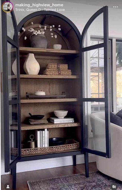 20 Arched Cabinet Styling Ideas » Lady Decluttered Aris Glass Door Cabinet, Styling A Cabinet With Glass Doors, Dining Room Curio Cabinet Decor, Styling Curio Cabinet, Arch Cabinet Styling, Black Arched Cabinet Living Room, Cabinet Styling Living Room, Arched Cabinet Styling, Arched Cabinet Decor