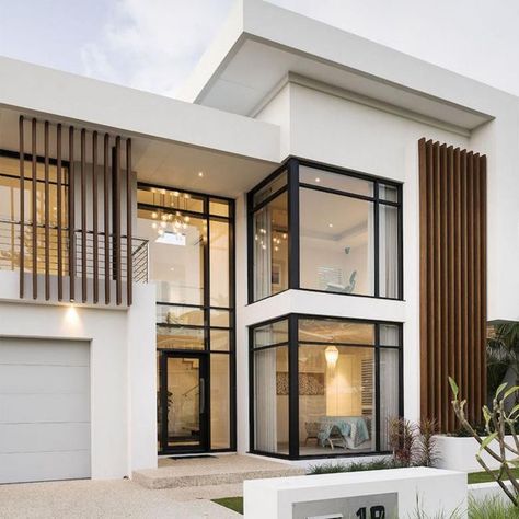 Thoughts on this white interior with the black detailing? ✨ We LOVE the aesthetic! The colors make the house look bigger, cleaner, and super premium. Backyard Sanctuary, Duplex Design, Casa Country, Modern House Facades, Modern Exterior House Designs, Duplex House Design, Storey Homes, House Outside Design, Modern Architecture House