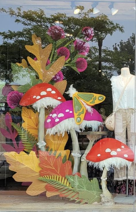 Cardboard Mushroom Cutout, Fairy Garden Window Display, Fairy Window Display, August Window Display Ideas, Mushroom Window Display, Forest Window Display, Mushroom Backdrop, Different Ways To Hang Curtains, Fall Window Display Store Fronts