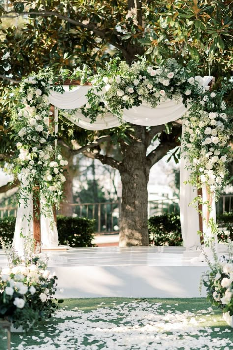 We are obsessed with the white drapery and white roses on this beautiful chuppah. Planned by Best Bride. Instagram- @bestbride_ Wedding Chuppah Flowers, Huppah Wedding, Unique Wedding Arch, Unique Wedding Locations, Chuppah Flowers, Chuppah Ideas, Wedding Pergola, White Wedding Arch, Wedding Chuppah