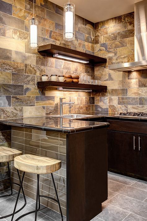 One of the most defining qualities of slate is its unique color palette. Slate lends itself to rustic and outdoor installations but is just at home in a contemporary bathroom or kitchen. Slate Backsplash Kitchen, Rustic Tile Backsplash, Tiled Kitchen Floor, Mongolian Desert, Slate Backsplash, Entry Floor, Bar Tile, Mountain Kitchen, Slate Wall Tiles