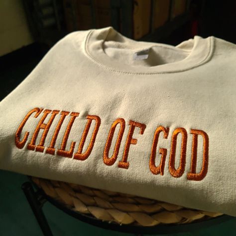 Child of god christian clothing, child of god sweatshirt, Embroidered sweatshirt, faithful christian hoodie, christian tshirt stronger than the storm, trending christian hoodies, christian gifts for her and him, bible verse clothing, bible verse sweatshirt, tshirt bible verse, inspirational sweatshirt, verse inspiration clothing I've included images showing the design on a Sand Sweatshirt, please message me for specific sweatshirt colour requests/a request for changing the embroidery colour. ▶️ Christian Jumpers, Men’s Christian Apparel, God Merch, Christian Sweatpants, God Sweatshirts, Christian Wear, Christian Gifts For Him, Christian Sweatshirts, Things I Want