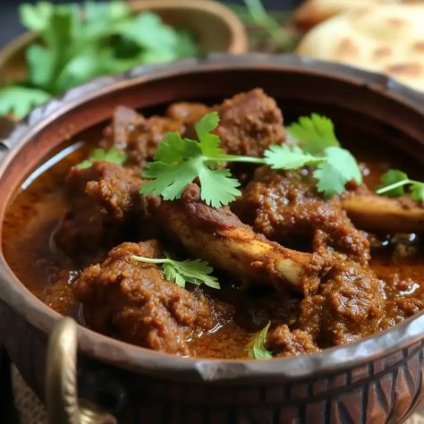 Champaran Mutton, also known as Ahuna Mutton, is a celebrated delicacy from the Champaran district in Bihar, India. This dish is renowned for its unique cooking method, where the mutton is slow-cooked in an earthen pot, allowing the meat to imbibe the earthy flavors and the rich blend of spices. Traditionally, the pot is sealed with wheat dough to ensure that the steam and flavors are locked in, resulting in a tender and aromatic preparation that is sure to tantalize your taste buds. Champaran Mutton, Mutton Recipe, Mutton Recipes, Red Chili Powder, Cooking Method, Slow Cooked, Chili Powder, Amazing Flowers, Taste Buds