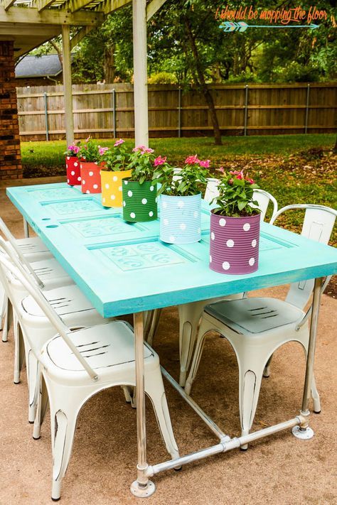 Old Door Patio Table | Make a fun table with plumbing conduit and an old door! Complete photo tutorial. Old Door Tables, Old Door Projects, Recycled Door, Door Table, Patio Decorating Ideas On A Budget, Cool Tables, Old Door, Outdoor Patio Decor, Diy Furniture Table