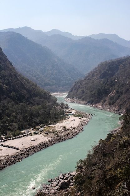 Ganga river near rishikesh uttarkhand in... | Premium Photo #Freepik #photo #ganga #mountain-water #view-background #natural-views Ganga River Photography, Nature Shoot, Ganga River, View Background, Natural Views, Shakti Goddess, River Basin, Art Appliqué, River Photography