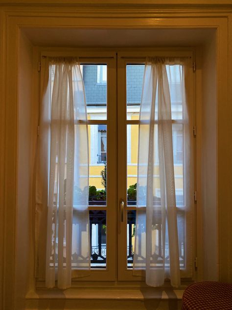 French hotel’s balcony window view of a yellow building through sheer curtains on a bright sunny summer day Lyon France Apartment, France Apartment, Apartment Window, Aesthetic Window, Window Views, Colorful Apartment, Shop Buildings, Lyon France, Window View