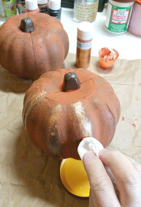 dab-on-the-gold-paint-using-a-paper-towel Paint Styrofoam Pumpkins, Painted Foam Pumpkins, How To Paint Foam Pumpkins, Spray Foam Pumpkin, Foam Pumpkin Ideas, Dollar Tree Styrofoam Pumpkins, Styrofoam Pumpkin Crafts, Dollar Tree Foam Pumpkin Ideas, How To Paint Styrofoam