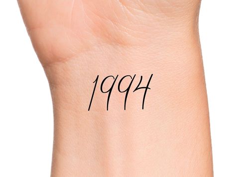 "1994 Year Temporary Tattoo Size: The size of this Temporary Tattoo is approximately 1 inch in length. If you would like this design in a smaller or larger size that isn't listed, please message me on Etsy and I would be more than happy to accommodate you. Directions: 1. Cut excess paper around tattoo with scissors to eliminate any unnecessary adhesive on your skin after applying. 2. Peel away and discard the clear plastic layer. 3. Apply the tattoo image side to your skin and cover with a damp 1991 Tattoo Number, 1992 Tattoo, Tattoo Numbers, Birth Year Tattoo, Numbers Tattoo, Year Tattoo, Tattoo Number, Number Tattoo, Number Tattoos