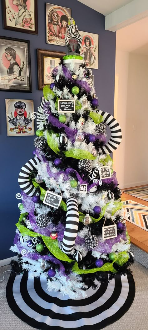 Nightmare Before Christmas Tree Walmart, White Halloween Christmas Tree, White Halloween Tree Decorating Ideas, Ouija Board Halloween Decor, Nightmare Before Christmas Christmas Tree Theme, Beetle Juice Tree, Beetlejuice Halloween Tree, Purple And Green Halloween Decor, Beetlejuice Christmas Decorations