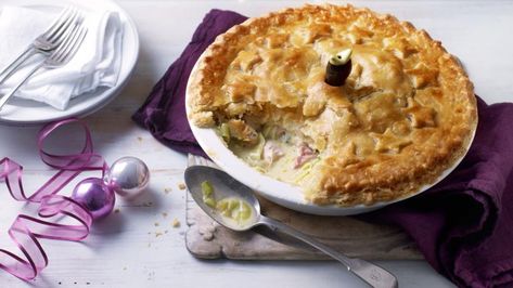 ► Paul Hollywood Leftover Turkey and Ham Pie Recipe: flour, salt, butter, leeks, orange, medium sherry, chicken stock, wholegrain mustard, leftover turkey, ham, fresh tarragon, cream, egg, salt & white pepper. Mix flour & salt. Rub in butter. Add cold water to form dough. Roll into rectangle. Grate frozen butter over bottom 2/3rds. Fold like puff pastry. Turn 90°, roll out, repeat with remaining frozen butter. Rest 30 mins. Fill pie dish, cool. Roll pastry ¼" thick. Make pastry lid, cut steam ho Turkey And Ham Pie, Ham Pie, Coronation Chicken, Chicken Pie Recipe, Savoury Pies, Scrumptious Food, Chicken Pie, Bbc Food, Bbc Good Food