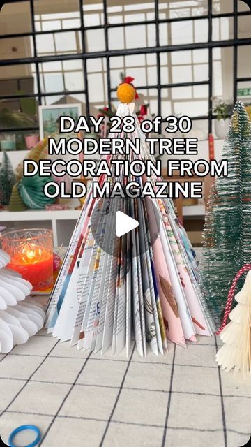 Cotton Clara on Instagram: "DAY 28 - MODERN TREE DECORATION USING AN OLD MAGAZINE You might have seen this before, but I’ve never seen it done with a magazine, only old books. Which look really cool too, I just have lots of old magazines lying around that I could use.  The repetitive nature of this is really relaxing, you could totally to this in front of the TV. I love that you get a really high impact decoration for very little money & effort?! These would look great all in a row, or mix them up using different sized books or magazines? You’ll obviously get a more neutral look if you use an old book as it’s just going to be black and white, or use magazines like I have if you like a more colourful look! #christmascraft #craftychristmas #easycraft #craftingwithkids" How To Make Magazine, Old Magazine Crafts, Book Christmas Tree, Old Magazine, Holiday Diy Projects, Fruit Display, How To Make Christmas Tree, Magazine Crafts, Christmas Tree Painting