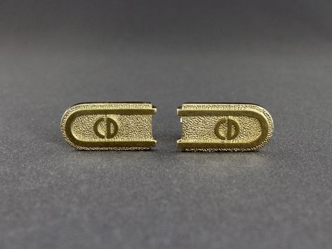 Made by Christian Dior, this is a classic of pair CD logo made in Germany gold tone textured and smooth cufflinks. The shiny gold tone cufflinks have a textured background with raised smooth border and the Dior logo in the center. The shank is attached to the back of the cufflinks at an angle. A nice size, they measure 7/8 inch wide, 3/8 inch tall and 1/16 inch thick. The cufflinks are in very good vintage condition.  The top of each toggle is signed Chr. Dior©, and the bottom of each toggle is signed Germany. All items are carefully wrapped, placed in a new gift box and tied with curling ribbon. This item will be shipped via USPS first class mail. If you want to purchase insurance, email me and I will add that cost to the item. Uninsured items that are lost or damaged in transit are the r Dior Logo, Vintage Christian Dior, Curling Ribbon, Vintage Cufflinks, Tie Clips, Tie Bar, Tie Accessories, Vintage Accessories, Textured Background