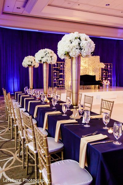 Champagne And Royal Blue Wedding, Royal Blue And Champagne Wedding Theme, Royal Blue Champagne Wedding, Royal Blue And Rose Gold Wedding, Blue And Gold Indian Wedding, Rose Gold Wedding Reception, Tall Floral Centerpieces, Wedding Rose Gold Theme, Royal Blue Wedding Theme