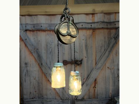 Rustic farmhouse pendant lighting, with antique farm pulley and vintage mason jar lights, farmhouse cabin decor for kitchen, dining room Vintage Pulley Ideas Decor, Pulley Light Fixture, Farmhouse Diys, Farmhouse Cabin Decor, Pulley Ideas, Rustic Industrial Lighting, Pulley Light, Mason Jar Light Fixture, Rustic Ceiling Lights