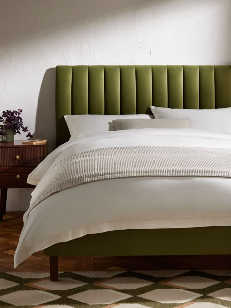 We've made the headboard a defining design element of the Fluted bed frame, adding extra padding to give the bed an elegant, curved side profile and giving even more depth to the flutes. Finished with a tapered dark stain leg to ensure the bed looks just as good in both traditional and contemporary rooms. Made from high-quality timbers. Its sprung slats provide a more supportive foundation for your mattress.  Assembly service Our assembly service is included in the selling price for our Made to Olive Green Velvet Headboard, Green Bed Head, Light Green Bed Frame, Fluted Bed Frame, Olive Green Bed Frame, Green Bed Bedroom Ideas, Bedroom With Green Bed, Green Bed Bedroom, Green Bed Frame Bedroom Ideas