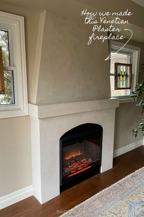 We're finally sharing our Venetian Plaster Fireplace DIY! It is beautiful and functional and solves a bunch of problems with our living room. Today we're sharing how we built the DIY electric fireplace wall of our dreams and how to apply Venetian plaster. Diy Faux Plaster Fireplace, Diy Limestone Fireplace, Black Venetian Plaster Fireplace, Plaster Fireplace With Wood Mantel, Diy Electric Fireplace Wall, Venetian Plaster Fireplace, Fireplace Mantels Decor, Diy Electric Fireplace, Plaster Fireplace