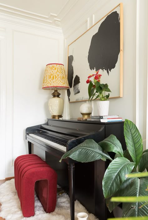 Eclectic Piano Room, Alternative Piano Bench, Modern Piano Bench, Modern Piano Decor, Piano Interior Design Modern, Black Upright Piano Decor, Piano With Plants, Shelf Above Piano, Electric Piano In Living Room