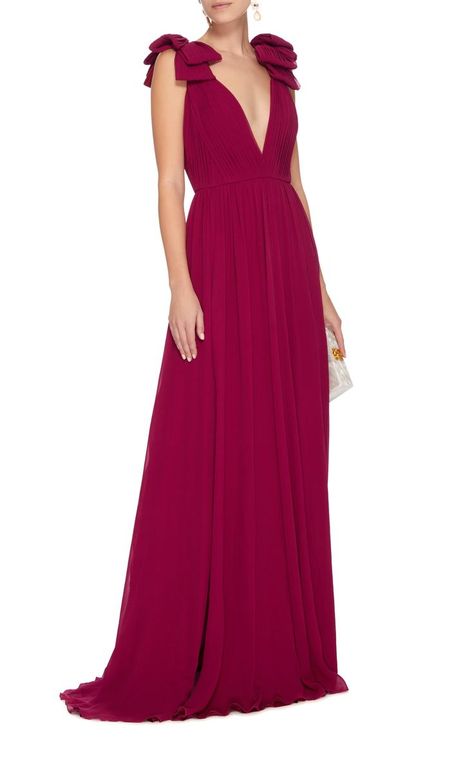 This Elie Saab gown features a deep-V neckline, bow detail on shoulders, pleating on bodice and skirt, and thigh high slits on front side of legs. Celebrities At Coachella, Long Dress With Bow, Bow Shoulder Dress, Tango Dresses, Chic Evening Dress, Best Wedding Guest Dresses, Backless Dresses, Gown Ideas, Viva Magenta