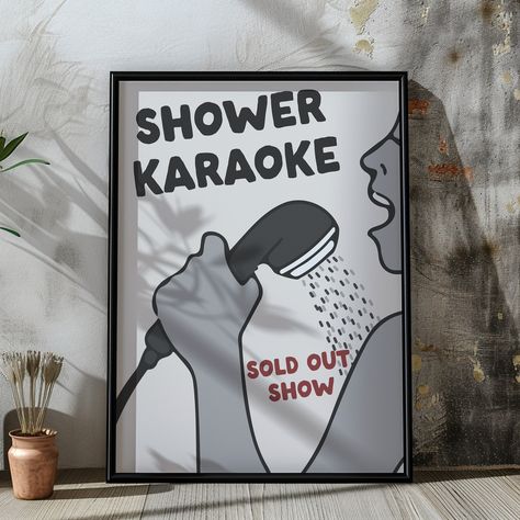 Bring fun and humour to your space with our Shower Karaoke print, capturing the joy of singing your heart out in the shower. This lively illustration showcases the playful spirit of Shower Karaoke, featuring a character passionately singing into a shower head. With bold text reading "Shower Karaoke" and a cheeky "Sold Out Show" tagline, this print is perfect for anyone who enjoys the simple pleasure of a private concert under the spray.  Ideal for brightening up a bathroom or adding a whimsical touch to any room, this artwork makes a fun gift for music lovers or a unique addition to your own decor, celebrating everyday moments with a smile. HOW TO ORDER: Select the Size from the drop down menu and we'll do the rest. PRINT DETAILS: -Size: Multiple sizes available - please see the image for Shower Karaoke, Aesthetic Shower, Gifts For Swimmers, Wall Art Funny, Funny Home Decor, Quirky Illustration, Poster Aesthetic, Bold Text, Gifts For Sports Fans