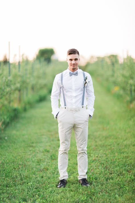 white groom style with light blue bow tie and suspenders Mens Wedding Attire Suspenders, Light Blue Suspenders And Bow Tie, Dusty Blue Suspenders Wedding, Tux With Suspenders, Groom Suspenders Bow Tie, Blue Bow Tie And Suspenders, Light Blue Suspenders, Country Wedding Groomsmen, Suit With Suspenders