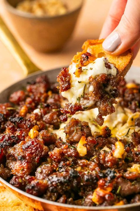 Whether feeding a crowd or enjoying a snack for yourself, this Sausage Baked Brie is a great option. Made with pork sausage, brown sugar, and walnuts, this appetizer or snack is overflowing with flavor! Brown N Serve Sausage Recipes, Sausage Appetizers For Party, Baked Brie With Pecans And Brown Sugar, Sweet And Salty Sausage Baked Brie, Sausage Dip In Bread Bowl, Sausage Link Appetizers, Sausage Platter, Savory Apps, Brie Cheese Recipes