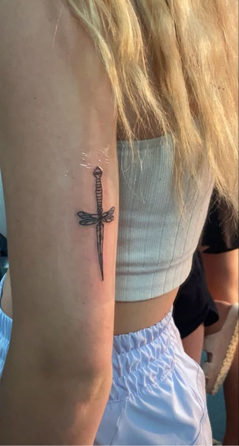 Tattoo Inspired By Music, Sward Flower Tattoo, Filled In Tattoos, Dagger Sternum Tattoo Women, Dragonfly Dagger Tattoo, Dainty Dagger Tattoo, Tiny Dagger Tattoo, Dagger Back Tattoo, Dragonfly Hand Tattoo