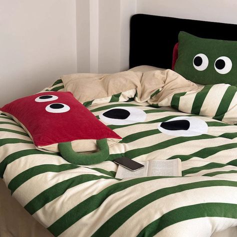 Snuggle up and stay cozy all night long with our Big Eyes Queer Thickened Warm Milk Velvet Four-Piece Coral Bed Set! Crafted from sumptuously soft velvet, this bed set is like a warm hug on a chilly night. With its thickened design, it locks in heat, keeping you snug and toasty without overheating. Embrace your inner kid with the playful cartoon stripes pattern and vibrant green and red colors. It's the perfect way to add a touch of fun and personality to your bedroom decor. Available in sizes f