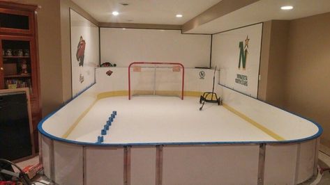 This 10' x 20' basement #syntheticice rink features D1 Glide Infused Self Lubricated #SyntheticIce and the combination of D1 Tall (42") and Short (24") #hockeyboards. D1 hockey #dasherboards are handcrafted in the U.S.A. D1 #hockeyboards will help your #outdoorrink project in so many ways. If you are considering #syntheticice and looking to build a synthetic #icerink or you need #hockeyboards for your #backyardicerink or #backyardrink, D1 #hockeyboards are the perfect #hockeyrink solution. Indoor Hockey Rink In House, Basement Hockey, Hockey Basement, Sports Room Man Cave, Hockey Man Cave, Hockey Organization, Synthetic Ice Rink, Indoor Hockey, Backyard Ice Rink