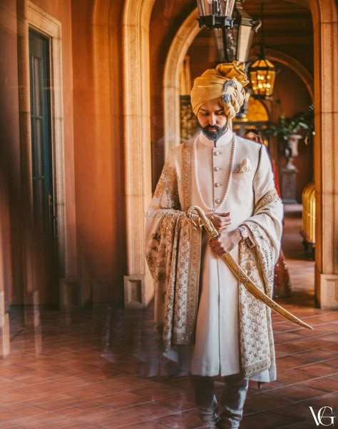 Photo of Royal groom look with him holding a sword Best Indian Wedding Dresses, Sherwani For Men Wedding, Dapper Grooms, Groom Dress Men, Wedding Outfits For Groom, Indian Groom Wear, Wedding Dresses Men Indian, Rajputi Dress, Sherwani Groom