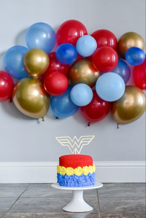 Wonder woman birthday party smash cake Oneder Woman 1st Birthday Cake, Wonder Woman First Birthday Party, Wonder Woman Birthday Theme, Wonder Woman Smash Cake, Wonder Woman 1st Birthday Party, Onederwoman First Birthday, Wonder Woman First Birthday, One Der Woman First Birthday, Oneder Woman 1st Birthday Decor