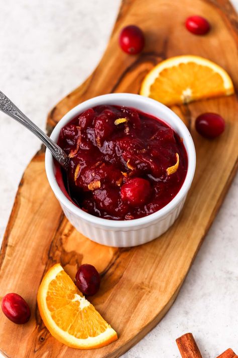 Zesty Cranberry Orange Sauce is easy to make homemade. Add cinnamon for a touch of spice and a whole lotta zest for a sweet, yet tart holiday sauce! Use the cranberry sauce on Thanksgiving or Christmas with your main meal and use leftover sauce as a jam on sandwiches or as a yogurt sweetener. #cranberrysauce #thanksgiving #christmass #withcinnamon #withorange Paleo Cranberry Sauce, Spicy Cranberry Sauce, Turkey Gravy Recipe Easy, Best Cranberry Sauce, Easy Cranberry Sauce, Honey Butter Recipe, Turkey Gravy Recipe, Tangerine Juice, Cranberry Sauce Recipe