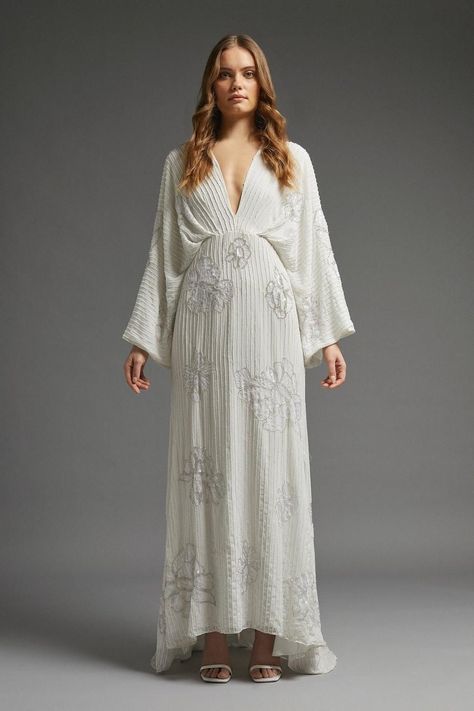 Model wearing a beaded kimono style long sleeved wedding dress High Street Wedding Dresses, Buy Wedding Dress Online, Coast Fashion, Buy Wedding Dress, Wedding Kimono, Bohemian Bride, Long Sleeve Wedding, Wedding Dress Sleeves, Sleeve Maxi Dress