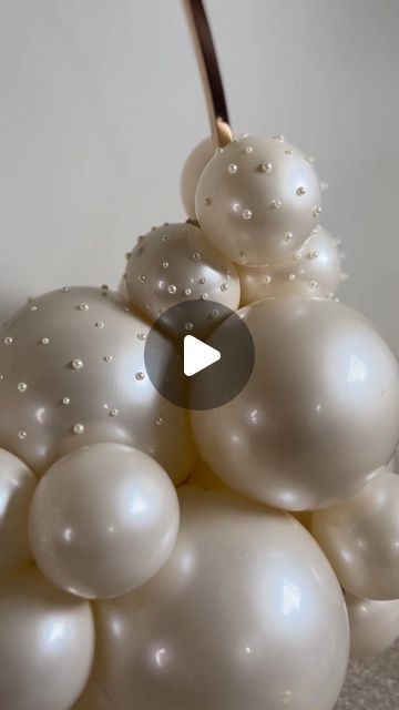 Luxury Balloon Styling Manchester by Kofi Steele on Instagram: "It’s giving wedding vibes🤍✨ How pretty are these pearl embellishments? Attention to detail at its finest! Can you guess where we are headed with this beauty this week? The clue is in the first line….. I’ll give you another one, it’s held at the NEC in Birmingham! Any guesses? . . . . . . . . #weddingdecor #weddingshow #weddingballoons #luxurydecor #luxurywedding #luxuryweddings #manchesterballoons #balloonsmanchester #birminghamballoons #balloonsbirmingham #pearls #pearlballoons #alessoninluxury #balloondecor #beautifulballoons #prettyballoons #balloonhoop #balloongarland #balloonarch #balloonartist #balloonstylist #balloondecoration #ballooninstallation #balloonbackdrop #weddingideas" Pearl White Balloons, Bridal Party Balloons, Pearls And Prosecco Balloon Arch, Pearls On Balloons, Pearl Balloon Decor, Diamond And Pearls Party Theme, Pearls And Persecco, Pearl Decorations Party, Pearl Birthday Theme