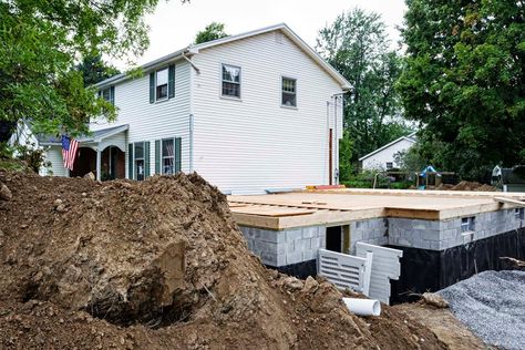 The cost to dig out a basement, whether for a new home, crawl space conversion, or full basement expansion, can yield an impressive return on investment. Waterproofing Basement Walls, Basement Addition, Building A Basement, Pool Water Features, Room Addition, Building Remodeling, Waterproofing Basement, Basement Walls, One Home