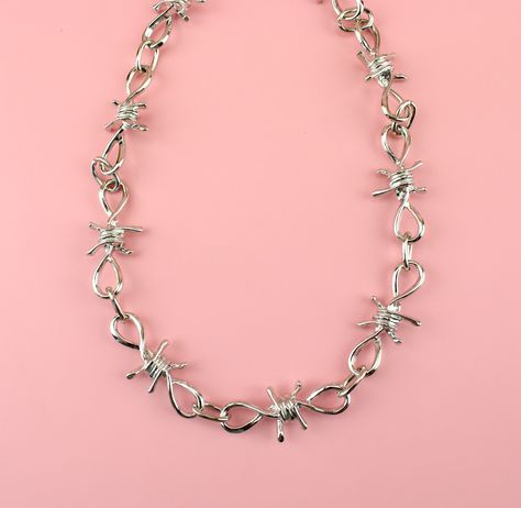 Show off your punk style with this one-of-a-kind barbed wire necklace! Our design features an ultra-thick barbed wire construction, making it the perfect accessory for anyone looking to stand out from the crowd. Load up that neckline with some punk -- you won't regret it! Measures 18 inches/46cm long Links measure 4.5cm wide x 1.9cm long each. Barbed Wire Jewelry, Shifting Hogwarts, Barbed Wire Necklace, Dude Style, Chain Tattoo, Hogwarts Dr, Xmas List, Better Things, Necklace Tutorial