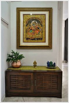 A collection of semi-precious stone Ganesha Statutes, an antique brass Kamakshi lamp and an exquisite Tanjore painting of Radha and Krishna Indian Inspired Decor, Indian Room Decor, Home Decor Indian, India Home Decor, Entrance Lobby, Indian Interiors, Indian Home Design, Construction Ideas, Indian Home Interior