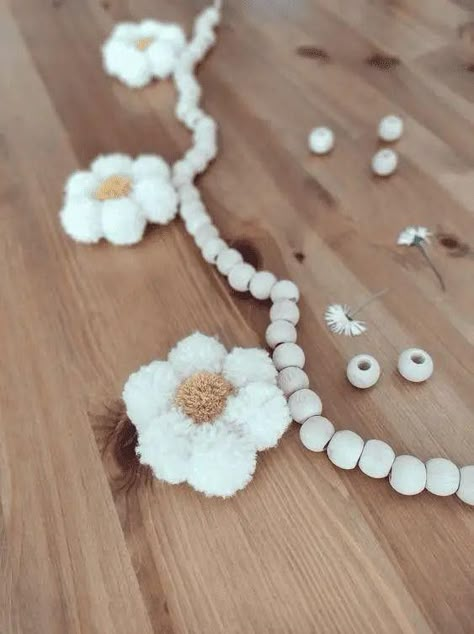 Diy Daisy Mobile, Pom Pom Nursery, Pom Pom Daisies, Diy Daisy Garland, Diy Daisy Wall Decor, Daisy Pom Pom Flower Diy, Wood Bead Flowers, Nursery Ideas Daisy, Daisy Boho Nursery