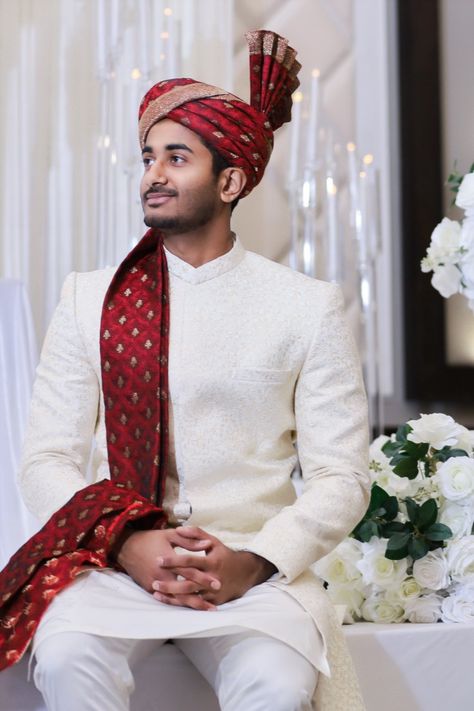 The groom sits down in front of the decorated stage to take some pre-wedding photos before the ceremony begins. Indoor venue in Toronto, Ontario, Canada. Sitting Down Pose, Emotional Moments, Toronto Ontario Canada, Gardens Wedding, Indian Groom, Pre Wedding Photos, Pre Wedding Photoshoot, Toronto Ontario, The Groom