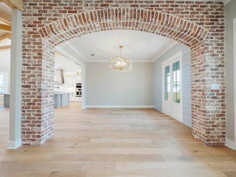 Faux Brick Hallway, Arched Brick Wall, Brick Interior Archway, Brick Inside House, Archways In Homes, Brick Arches, Kitchen Opening, Brick Archway, Brick Room