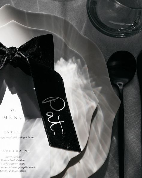 When Kayla came to me with the idea for these velvet name tags to complement what I would call a modern day black and white fairytale, how could I have said no! They were a labour of love but turned out better than we imagined 🖤 Bride @ivorybride.co Photographer @kinshipbykristy Styling / Table Hire @coeur___studio @ivorybride.co Florals little paddock_farmandflorals Menus @ivorybride.co #wedding #modernwedding #blackandwhite #stationery #weddingstationery #placecards #velvet #ribbon... Black And White Name Tags, Ribbon Name Tags, Black And White Stationery, Modern Chic Wedding, White Names, Black Velvet Bow, Black Theme, Wedding Bows, Wedding Ribbon