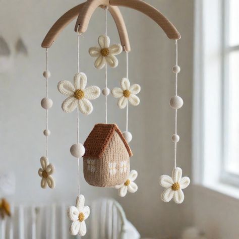 Our Daisy cottage nursery mobile    * modern, nature and minimalist * made in soft and warm earthy shades: beige, rust, cream, mustard * features  house designed in 3D shape surrounded with daisies   * makes the perfect accessory for a baby's space and a great gift for a mom-to-be! The hanger of this mobile is two half round arches 9.5'' in diameter made of untreated solid alder wood. Each item is lovingly hand knitted from high quality 100% wool yarn. Mobile is prepared for hanging it from the Daisy Mobile, Daisy Nursery, Cottage Nursery, Daisy Cottage, Mobile House, Angelina Ballerina, Animal Nursery Decor, Mobile Baby, Baby Crib Mobile