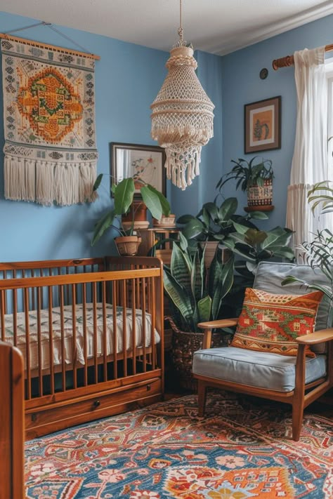 Transform your little boy's nursery into a haven of tranquility with these enchanting blue nursery ideas. From light pastels to bold navy hues, discover simple yet stylish designs to create the perfect space for your baby boy. Whether it's a minimalist theme or a charming nautical vibe, let these inspirations guide you in crafting a cozy and inviting room for your little prince. Nursery Ideas With Plants, Thrifted Nursery, 70s Nursery, Blue Nursery Ideas, Hippie Nursery, Eclectic Nursery, Retro Nursery, Minimalist Theme, Baby Room Themes