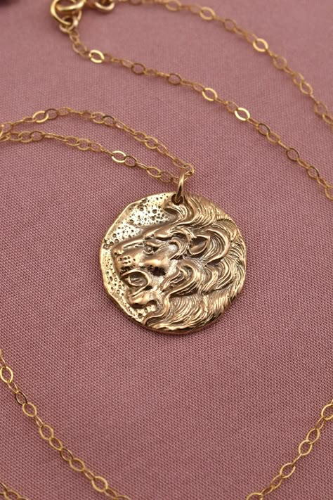 Lion Necklace 14Kt Gold-Filled & Bronze - Leo Zodiac Necklace - Roaring Lion Coin Pendant - Fierce Talisman Amulet - Inspirational Jewelry Gift for Girls or Women A fierce, roaring lion pendant strung on a glittering chain. The pendant is solid, high-quality, yet lightweight enough to be worn comfortably all day. The pendant measures approximately 20mm across (about 3/4 inch), and is made from shining, durable bronze. The chain and other components are 14Kt gold-filled. You necklace can be made Solid Gold Pendant Necklace, Gold Trinkets, Lion Jewelry Aesthetic, Gold Plated Zodiac Medallion Jewelry, Luxury Zodiac Sign Medallion Necklace, Leo Zodiac Jewelry, Leo Jewelry, Leo Zodiac Necklace, Leo Pendant Necklace