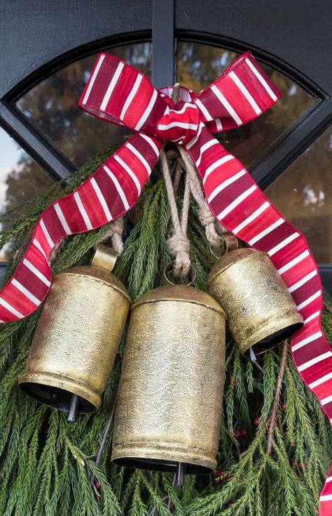 The perfect Christmas bells to hang on your front door! #bells #christmasdecor #christmasdecorating Cow Bell Decor, New England Christmas, Holiday Door Decorations, Diy Christmas Door, Christmas Door Decoration, Driven By Decor, Bell Decorations, Christmas Front Doors, Holiday Door