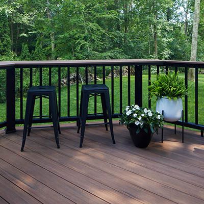 Two Tone Deck Color Schemes for a Unique Design | TimberTech Two Tone Stained Deck, Modern Deck Color Ideas, 2 Tone Deck Colors, Two Tone Decks Ideas, Deck Color For Dark Grey House, Painted Decks Colors Ideas Brown, Two Tone Wood Deck, Black Pool Deck, Two Tone Deck Color Ideas Paint